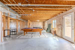 Game room featuring concrete flooring, a healthy amount of sunlight, and billiards