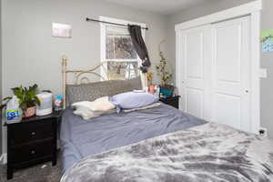 Bedroom featuring a closet and carpet flooring