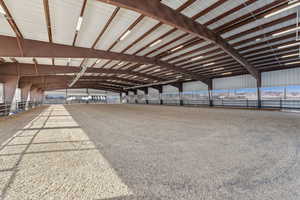 80’ x 160’ partially enclosed arena with Radiant heaters for winter comfort, and two LiftMaster controlled garage doors
