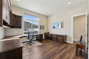 Office with custom built-in cabinets; canyon view towards the east