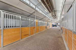 Heated barn with interlocking rubber brick aisle and five 12’ x 16’ fully matted stalls