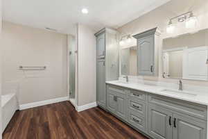 Basement full bathroom with walk-in shower and separate soaking tub