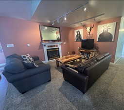 Living room/Den area featuring electric fireplace