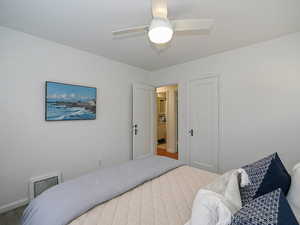 Bedroom featuring visible vents and ceiling fan