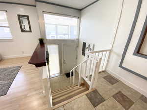 Foyer entrance featuring wood finished floors and baseboards