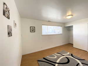 Bedroom featuring baseboards, visible vents, and light wood-style floors