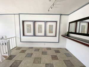 Corridor with stone finish floor and baseboards