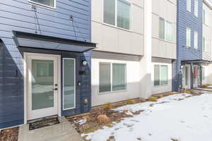 Property entrance with board and batten siding