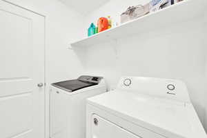 Laundry room featuring laundry area and separate washer and dryer