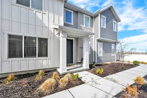 Property entrance featuring board and batten siding