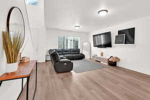 Living room featuring wood finished floors and baseboards
