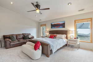 Carpeted bedroom with visible vents, recessed lighting, a ceiling fan, and vaulted ceiling