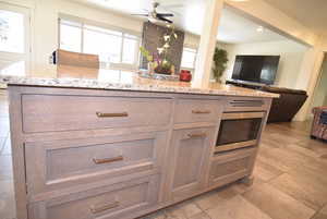 Kitchen island with storage drawers and stainless-steel microwave,