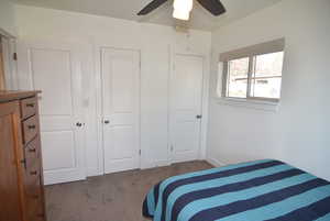 Bedroom #2 with Carpet flooring and dual closets.