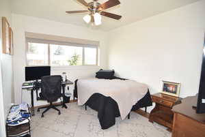 Bedroom #1 with hardwood finished floors and a ceiling fan