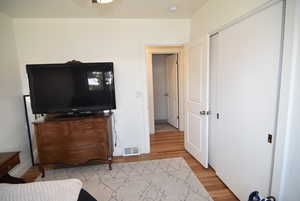 Bedroom #1 with a closet,and wood finished floors