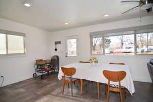 Dining area with a ceiling fan, recessed lighting, lots of natural light from upgraded windows.