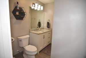 Updated Main Bathroom #1 with granite countertop vanity, tile floors and full tub/shower combo with tile surround.