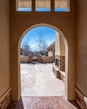 View of patio featuring a gate and fence