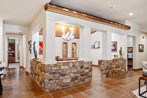 Interior space with an inviting chandelier and arched walkways
