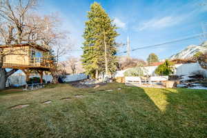 View of yard with stairway, a fenced backyard, and a wooden deck