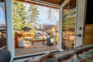 Doorway featuring plenty of natural light and a mountain view (tree house)