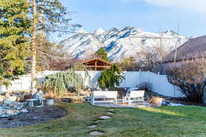 View of yard featuring a fenced backyard and a mountain view