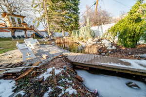 View of yard with stairway and fence