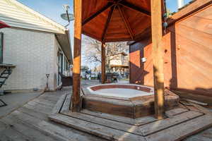 Wooden terrace with hot tub deck surround