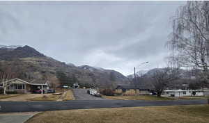 View of street with a mountain view and street lights