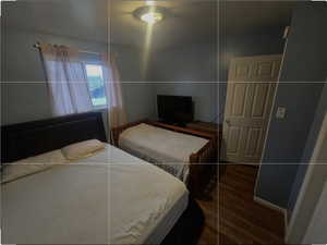 Bedroom with wood finished floors