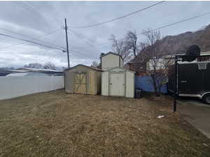 View of shed with fence