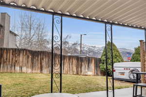 Exterior space featuring fence and a mountain view