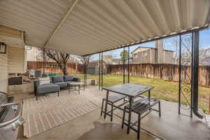 View of patio / terrace featuring an outdoor hangout area, an outbuilding, cooling unit, a shed, and outdoor dining space