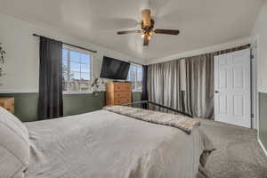 Bedroom with carpet floors and a ceiling fan