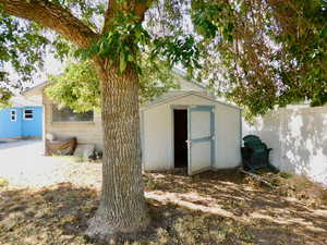 View of shed with fence