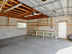 Garage with a garage door opener and concrete block wall