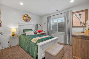Carpeted bedroom with visible vents and recessed lighting