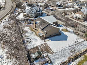 Snowy aerial view featuring a residential view