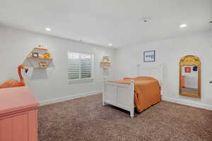 Bedroom featuring carpet floors, recessed lighting, and baseboards