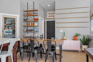 Kitchen with recessed lighting, open shelves, and light tile patterned flooring