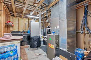 Utility room with separate washer and dryer
