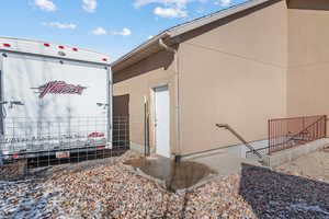 View of side of property featuring stucco siding