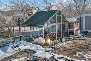 Exterior space with exterior structure, fence, and an outdoor structure