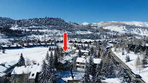 Snowy aerial view with a mountain view