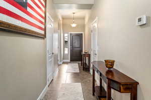 Entryway featuring tile patterned floors and baseboards