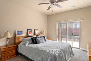 Carpeted bedroom with access to outside, a ceiling fan, visible vents, and baseboards
