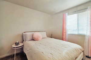 Secondary bedroom featuring large window