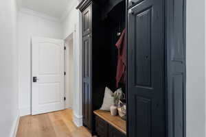 Mudroom with entrance to basement