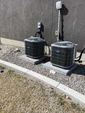 Exterior details with central air condition unit and stucco siding